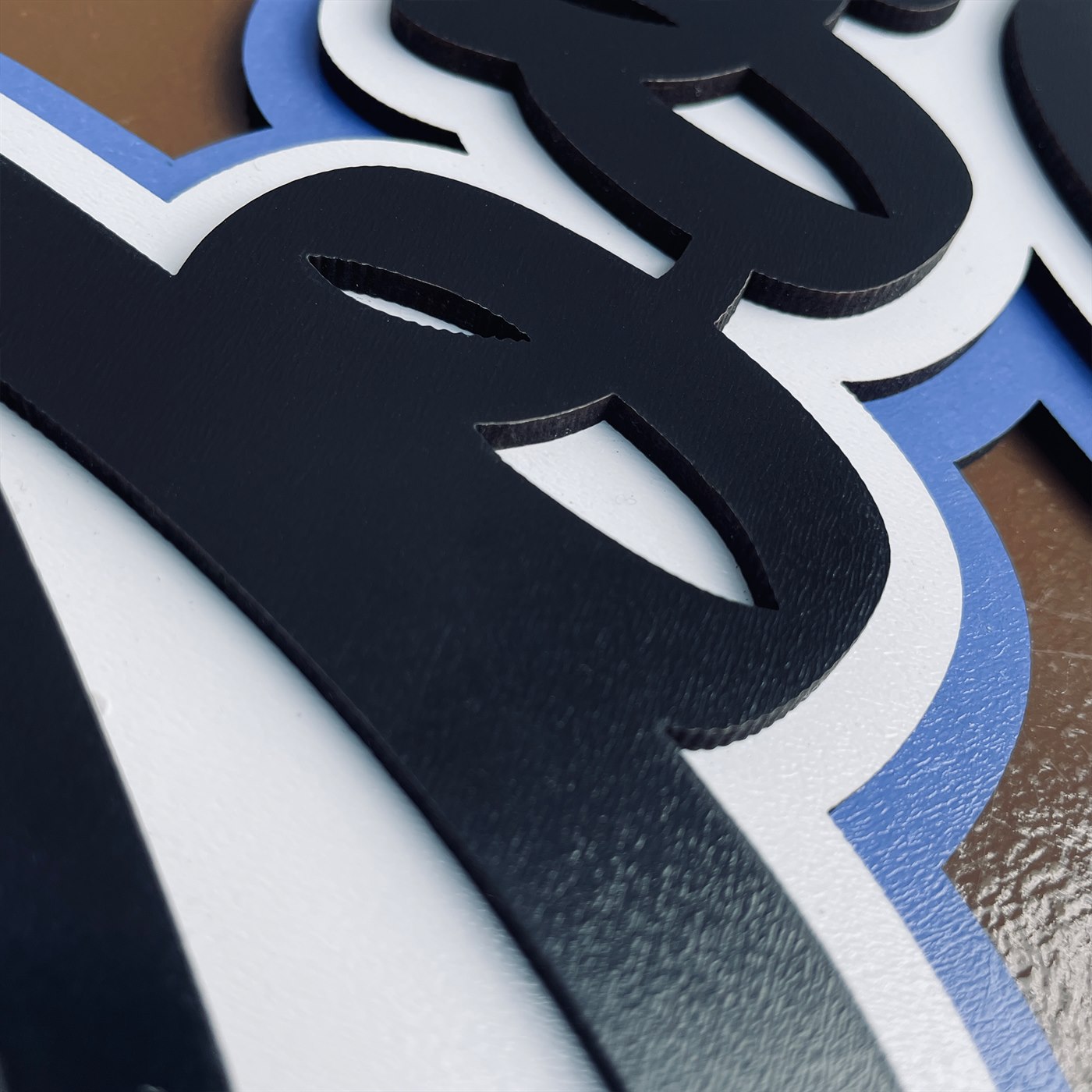 Good Vibes Only Macro Detail of Fluid Script Flourish and Cobalt Blue Relief