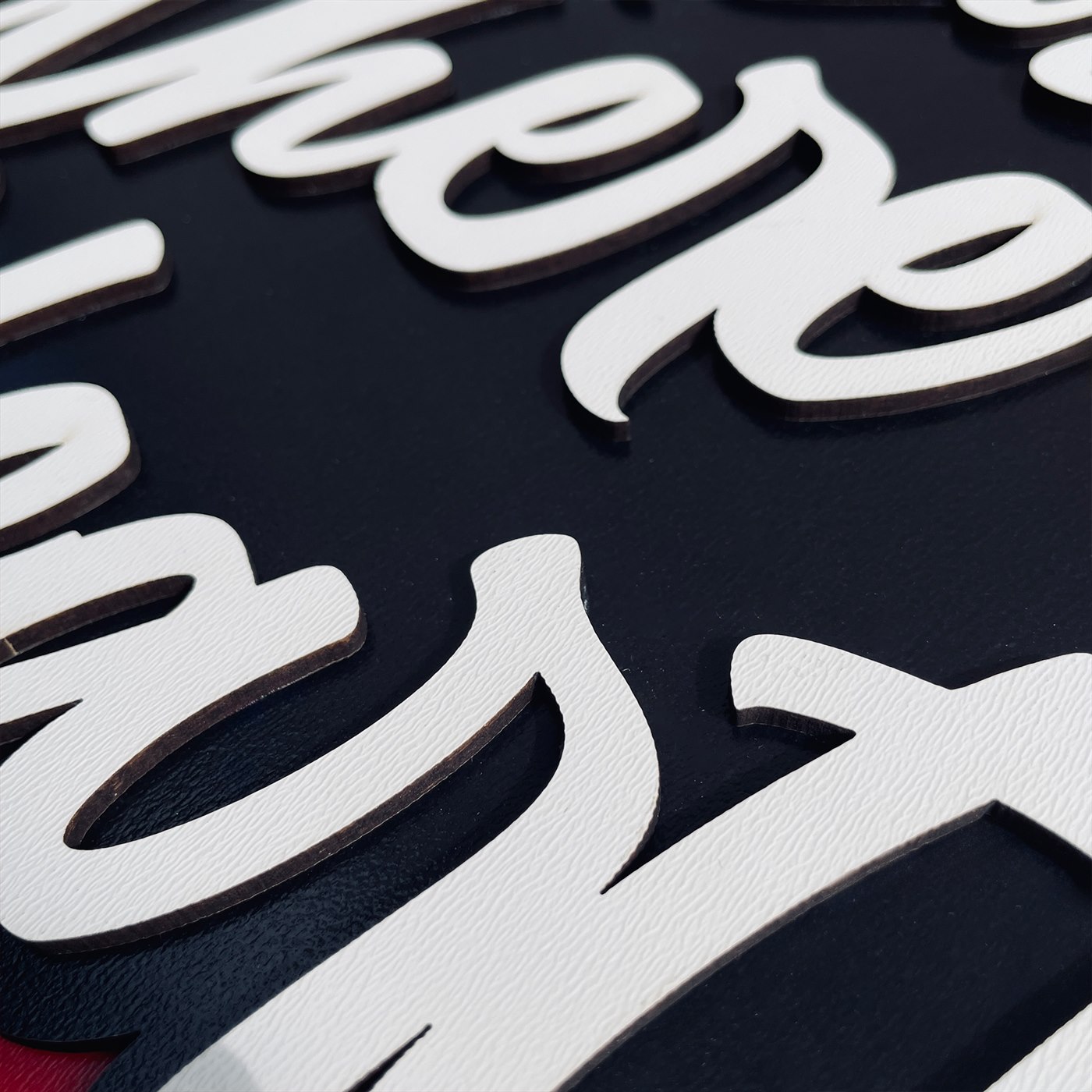 Home Is Where the Heart Is Macro Detail of Fluid Script Flourish and Crimson Heart Relief