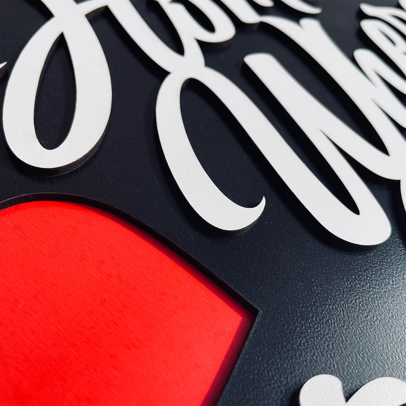 Home Is Where the Heart Is Macro Detail of Lettering Contours and Precision Laser Joinery